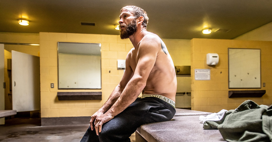 UFC fighter Cowboy Cerrone sitting in a locker room while wearing SHEATH Boxer Briefs