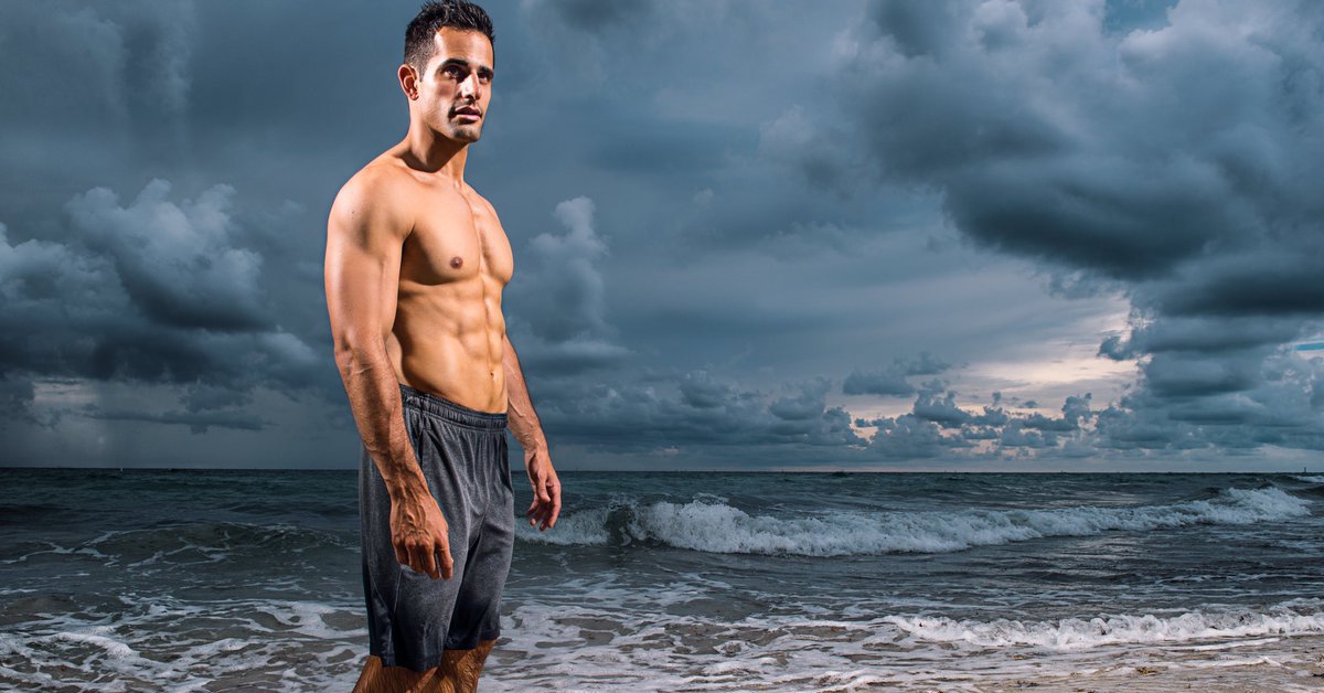 Photo of Chris Van Vliet on a beach