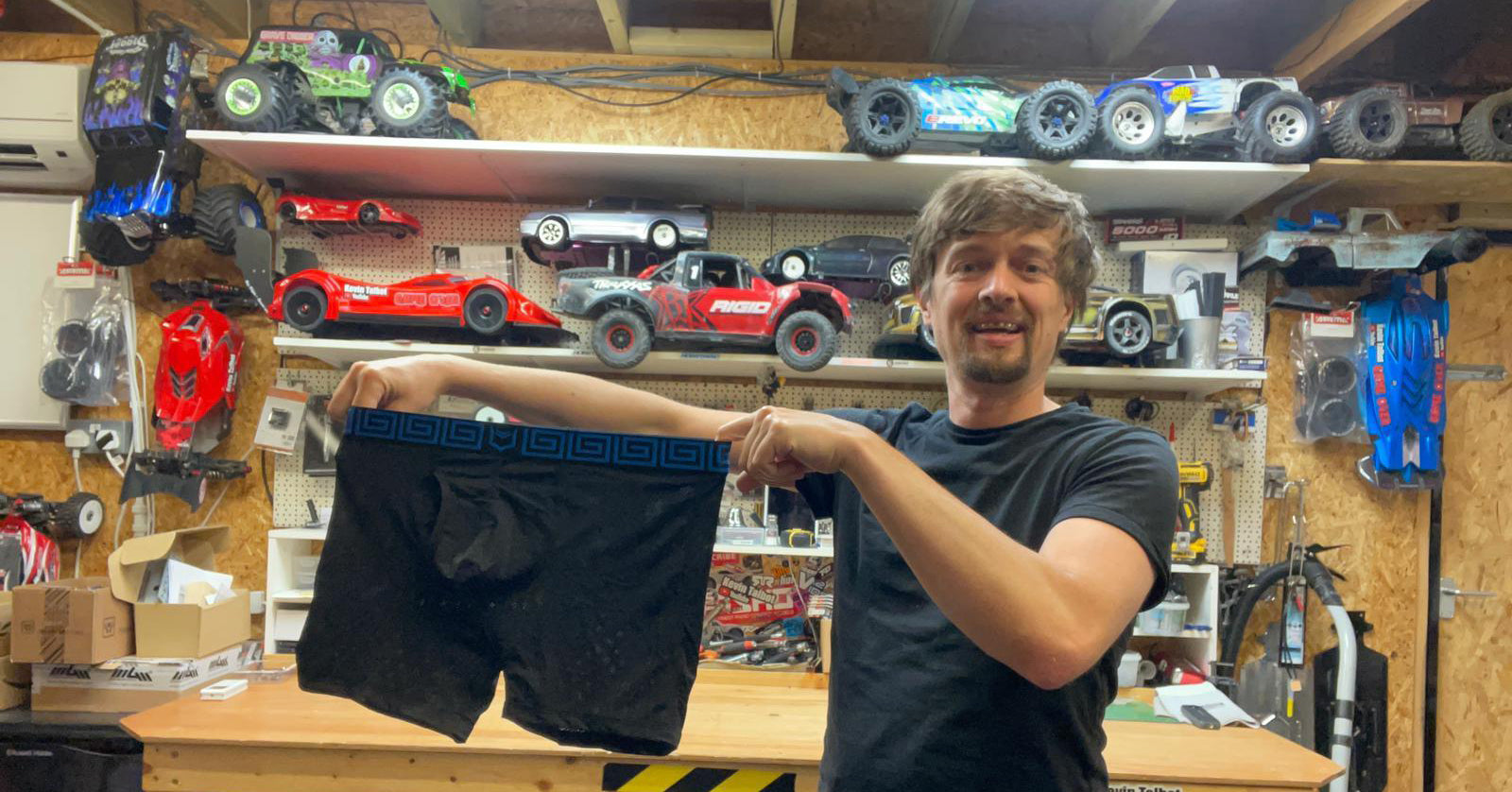 Photo of Kevin Talbot holding a pair of SHEATH
