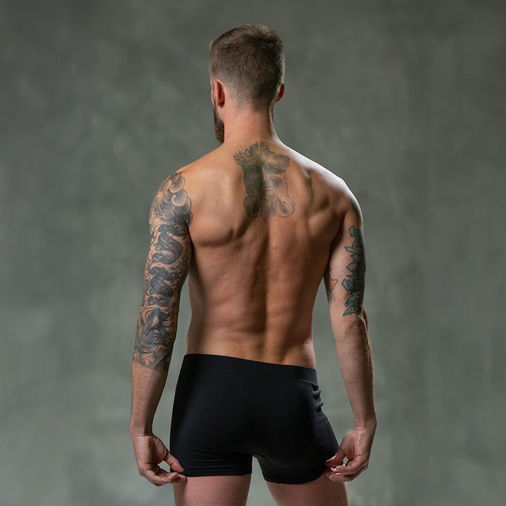 Backside of male model wearing SHEATH black classic modal men&