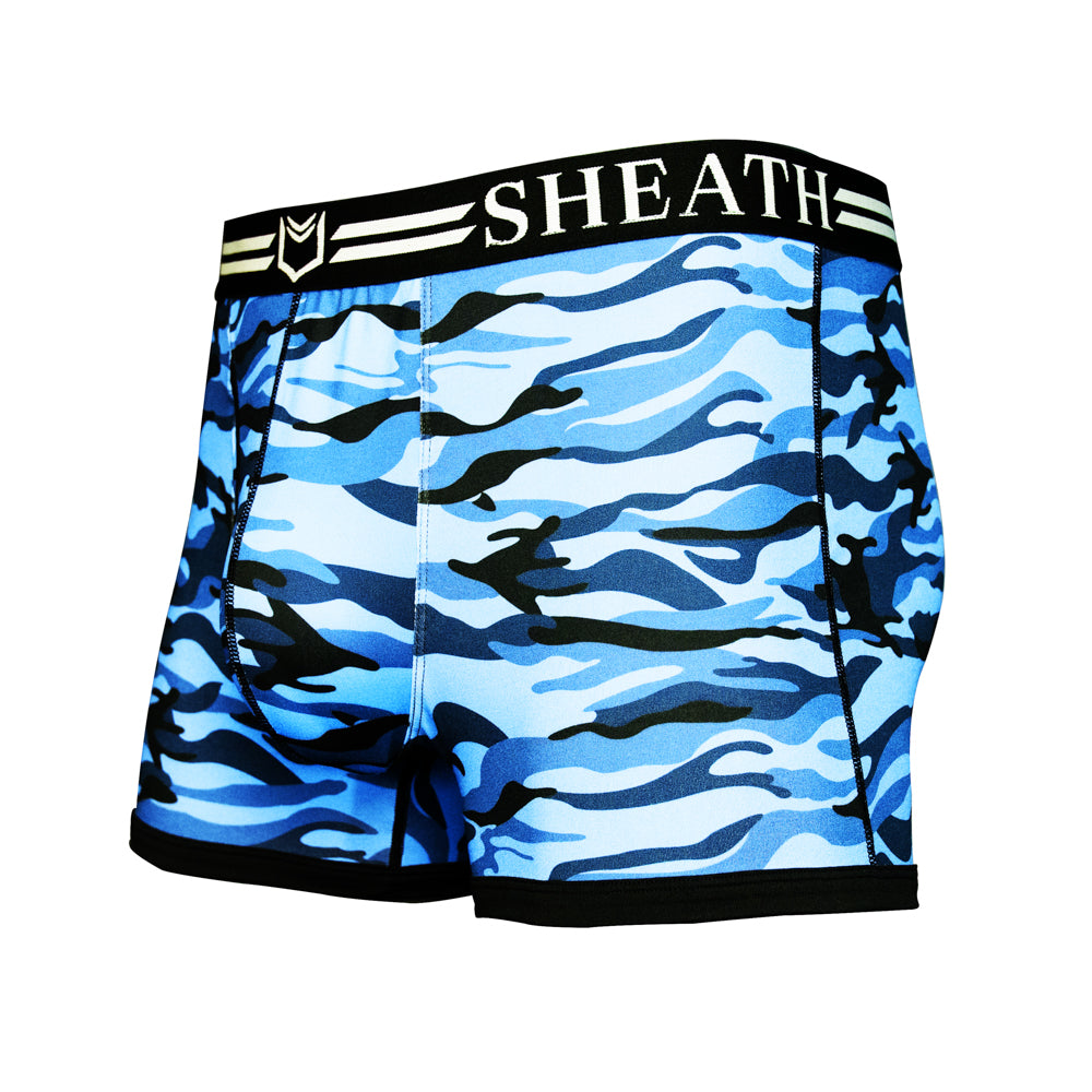 Men's trunks with a blue and black ocean-inspired camouflage pattern, featuring ergonomic dual pouch support, breathable moisture-wicking fabric, and a black waistband with white branding.#color_ocean-blue