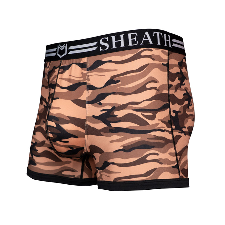 SHEATH Red and black camo men's trunks featuring dual pouch ergonomic support, breathable moisture-wicking fabric, anti-chafing comfort, and a branded elastic waistband with black trim left angle view#color_desert-red