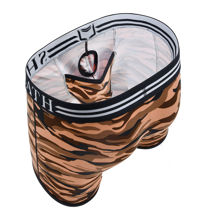 Red camo men's trunks with ergonomic dual pouch support, breathable moisture-wicking fabric, and a black-and-white branded waistband for all-day anti-chafing comfort.#color_desert-red