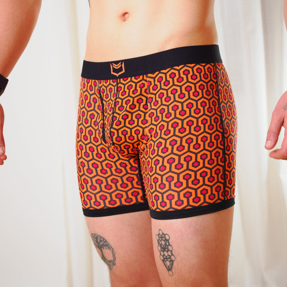 SHEATH 4.0 boxer brief - Orange hexagon print worn by a person on a white background