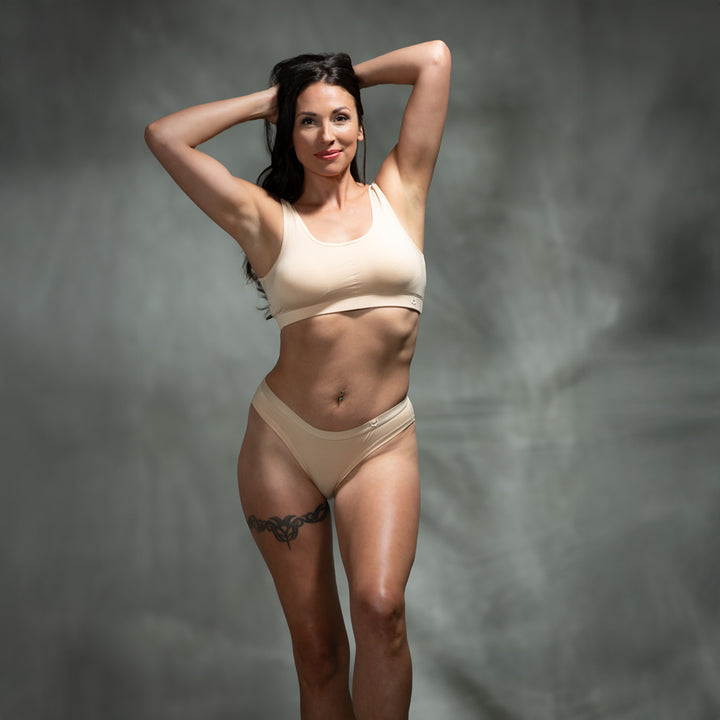 Female model wearing SHEATH nude padded comfort bralette and matching underwear made from soft, breathable bamboo fabric with an ergonomic fit for all-day support and comfort.