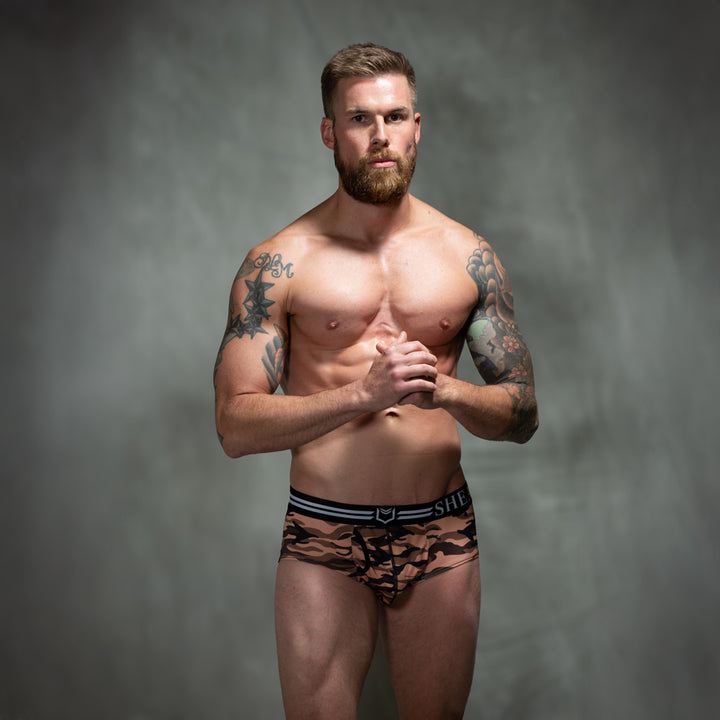 Male model in front of studio backdrop wearing men&