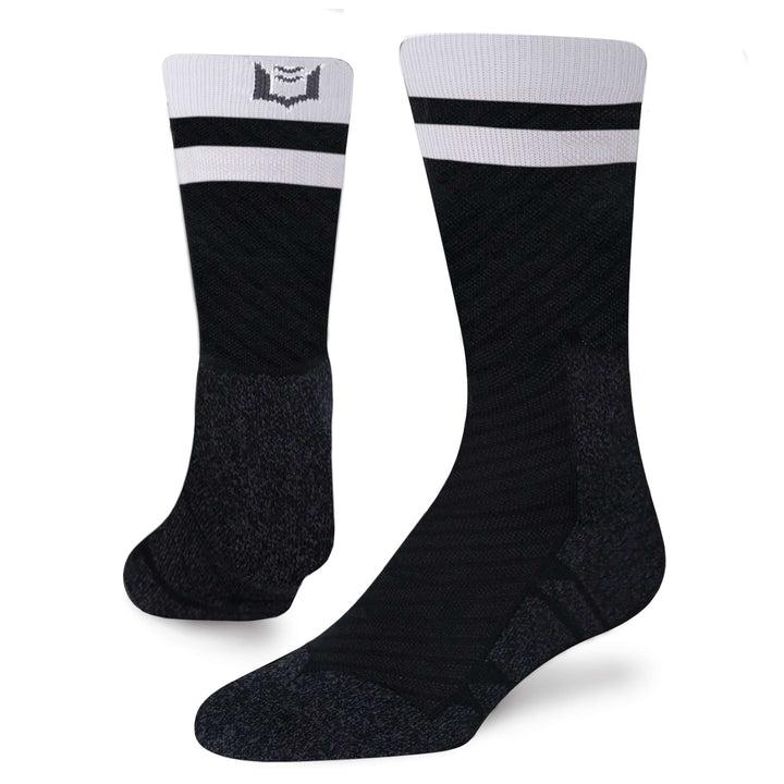 SHEATH Pair of black varsity crew socks with two white strips around calf featuring breathable fabric with subtle geometric pattern and cushioned support designed for active lifestyles and everyday comfort.