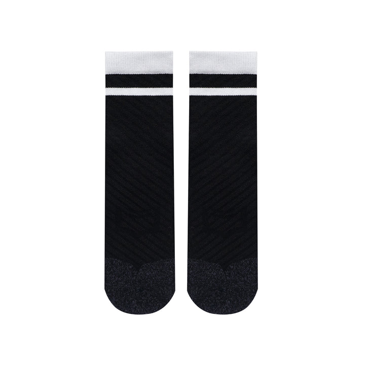 SHEATH Pair of black varsity crew socks with two white strips around calf featuring breathable knit fabric with subtle texture and cushioned footbed for enhanced comfort and moisture management during active use.#color_black-varsity