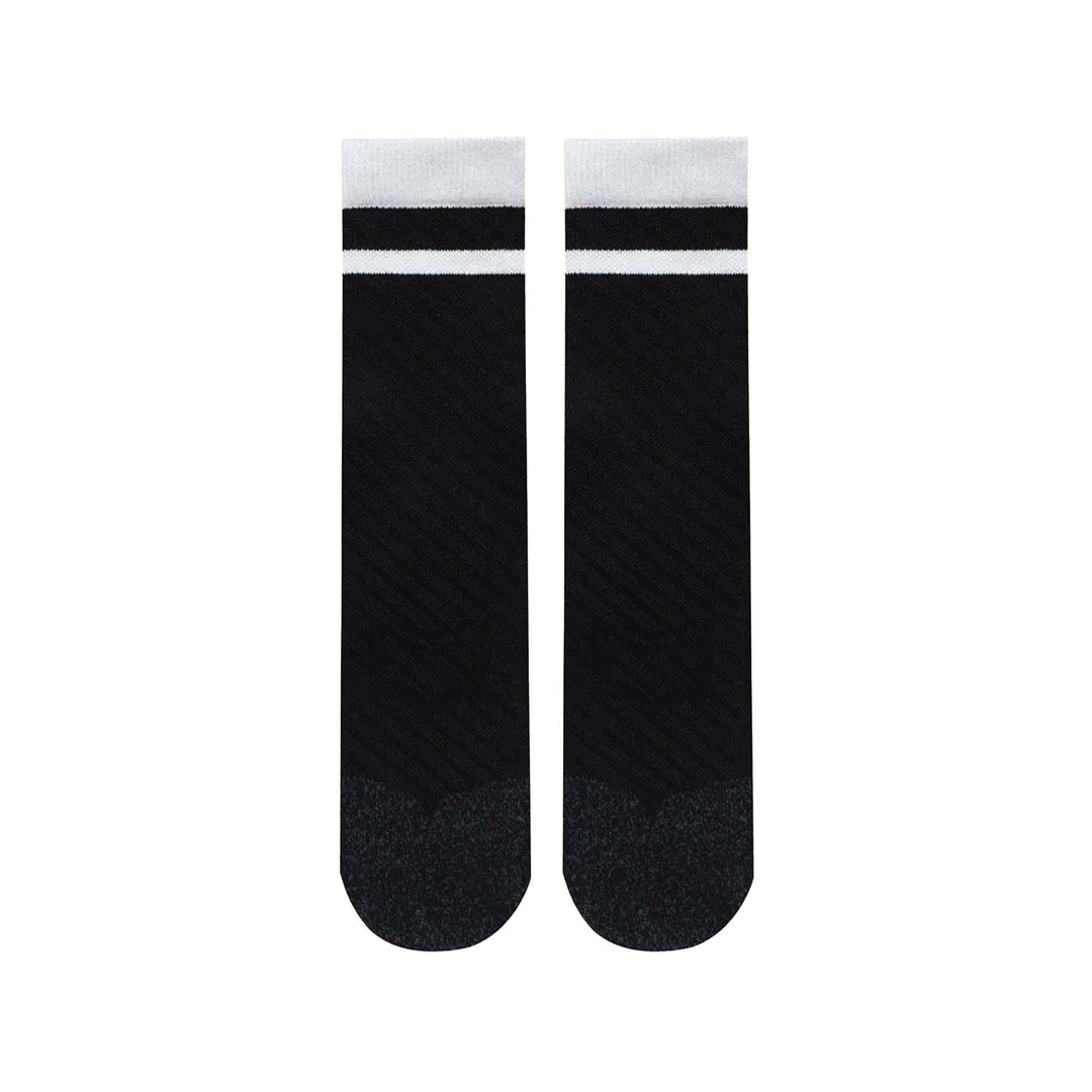 SHEATH Pair of black varsity crew socks with two white strips around calf featuring breathable knit fabric with subtle texture and cushioned footbed for enhanced comfort and moisture management during active use.