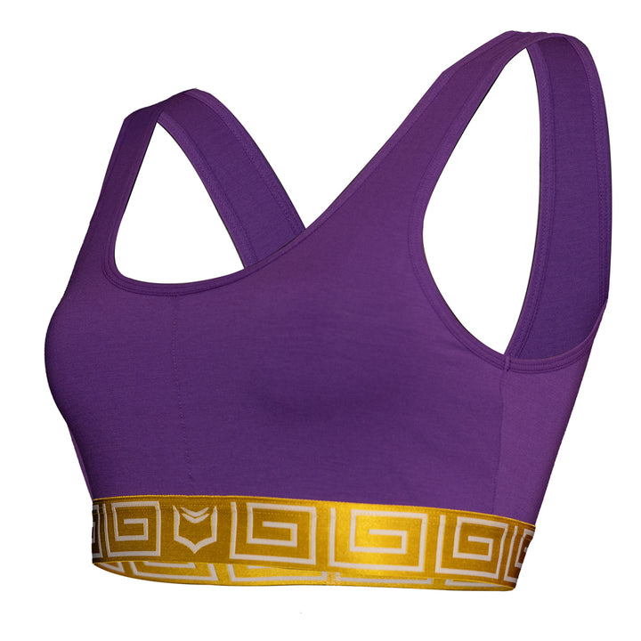 SHEATH purple &amp; gold sports bralette with wide shoulder straps and a supportive elastic band made from breathable, moisture-wicking fabric for comfort. left angle view