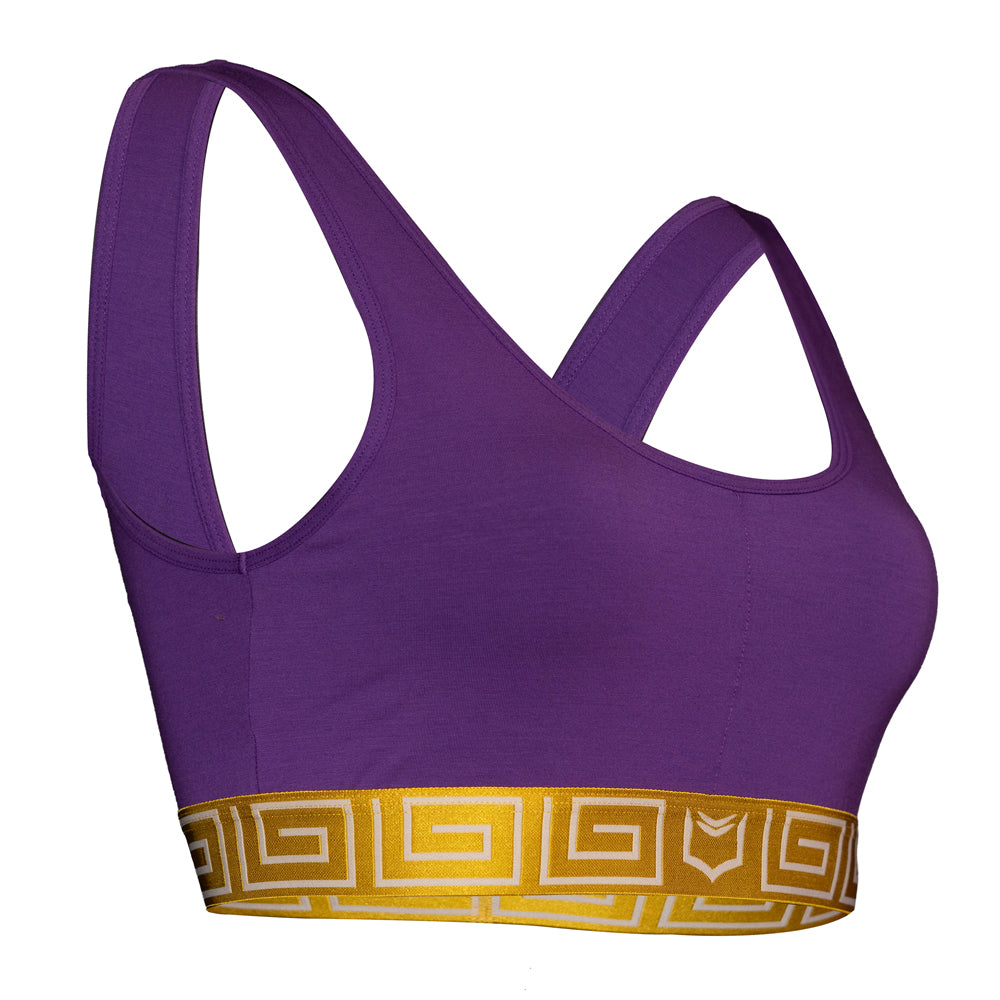 SHEATH purple &amp; gold sports bralette with wide shoulder straps and a supportive elastic band made from breathable, moisture-wicking fabric for comfort. right angle view